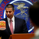After a meeting voting to end net neutrality, Federal Communications Commission (FCC) Chairman Ajit Pai, takes a sip from his comically over-sized mug while answering questions from the media.